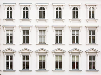Rows of windows on white facade of the building, architectural background