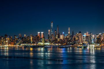 Fototapeta na wymiar Night light at Hudson River West Midtown Manhattan Buildings