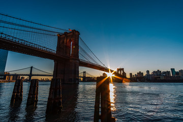 Sunrise at Brooklyn Bridge and Dumbo View from Lower Manhattan East River Side