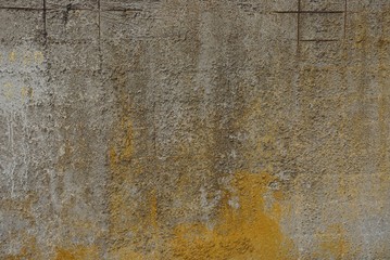 colored stone texture from old yellow gray concrete wall in the foundation
