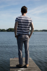 Young elegant handsome man posing outside.