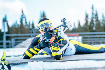 Detail of the rifle barrel biathlon shooter while aiming. The concept of precision and...