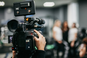 a journalist with a camera is interviewing