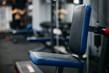 blue back gym machine with blurred background