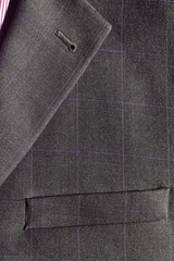 Part of a gray men's suit closeup.