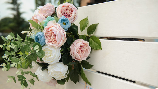 Wedding photo zone stand decorated with pink peonies and roses.