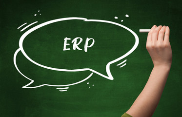 Hand drawing ERP abbreviation with white chalk on blackboard