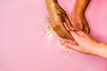 Fototapeta premium Hands and golden glitters.