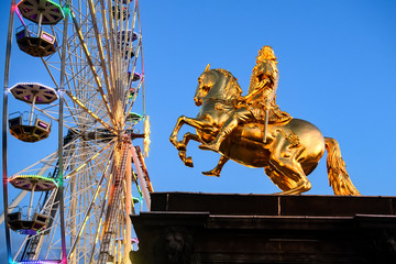 The Golden Rider or Goldener Reiter, the statue of August the Strong, near Ferris wheel. Saxony,...
