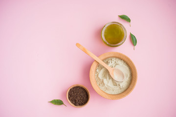 Cosmetic bath salt, grape gomaj for the face, coffee scrub for the body on a pink background.