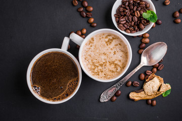 Mushroom Chaga Coffee Superfood Trend-dry and fresh mushrooms and coffee beans on dark background with mint. Coffee break