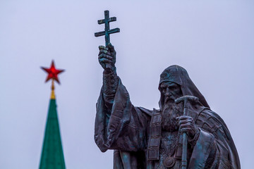 Moscow, Russia - March 22, 2019: Monument to the Patriarch Hermogenes of Moscow. Blurred tower of...