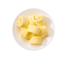 butter curls or rolls in ceramic bowl isolated on white background., top view