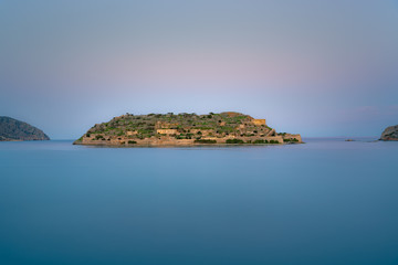View of the island of Spinalonga with calm sea. Here were isolated lepers, humans with the Hansen's desease, gulf of Elounda, Crete, Greece. 