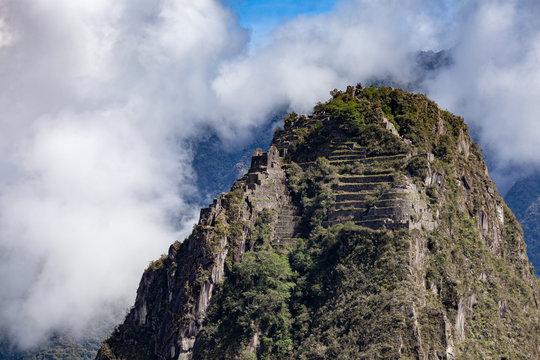 Wayna Pikchu close-up, terraces on top in the clouds, Machu Picchu, Peru.