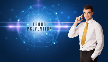 Businessman thinking about security solutions with FRAUD PREVENTION inscription