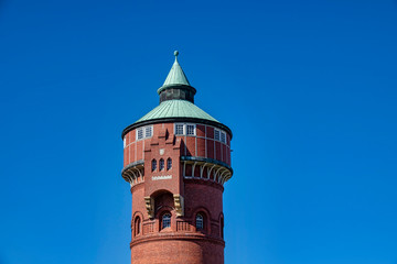 Historic red brick water tower built around 1900 in Berlin, Germany.
