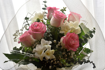 beautiful bridal bouquet with delicate pinkish white roses and white flowers