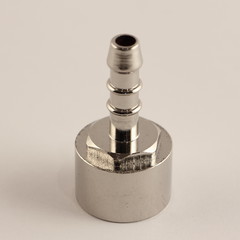 Chrome ribbed connector from 1/2" thread to hose, close up plumbing fixtures on white background