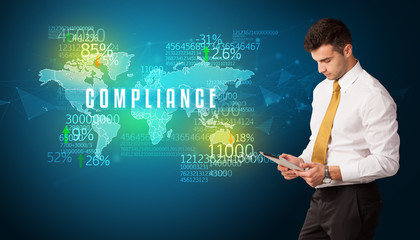 Businessman in front of a decision with COMPLIANCE inscription, business concept
