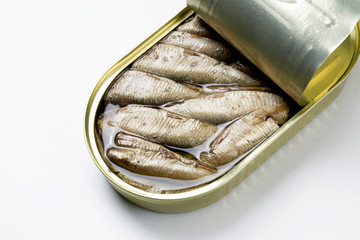 Open sprats can on white background close up