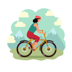 Fototapeta premium Young woman riding a bike in the mountains
