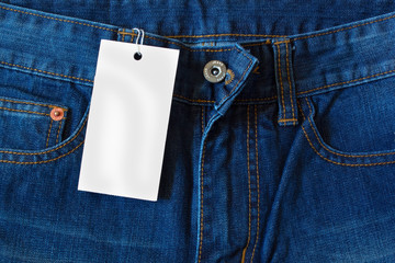 Element of jeans pants with white tag label.