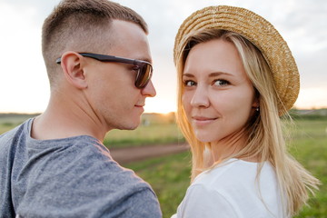 Fototapeta premium Portrait of a young couple at sunset