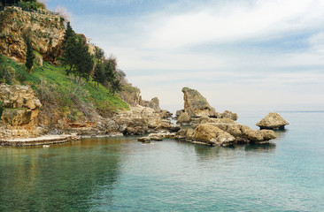 Fototapeta na wymiar Rock in the sea and blue sky in Antalya