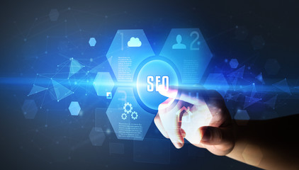 Obraz premium Hand touching SEO inscription, new technology concept