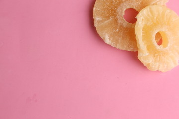 piece of dried pineapple fruit in color background