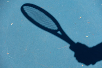 holding tennis racquet 