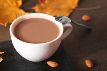 Chocolate drink in a white cup on a dark background