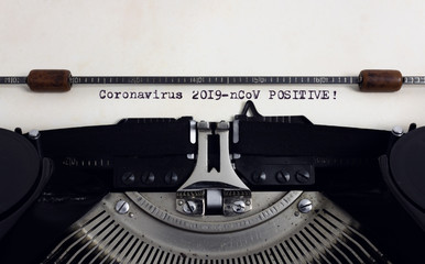 Old retro vintage typewriter with typed heading Coronavirus 2019-nCoV Positive