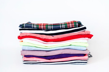 a pile of colorful clothes on white background