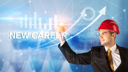 Young businessman with helmet drawing NEW CAREER inscription, modern business technology concept