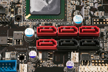 SATA connectors on the computer motherboard in a row.