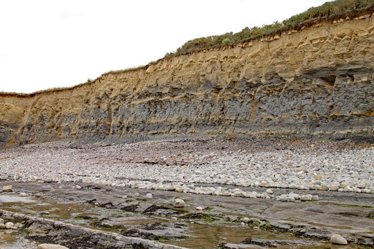 The cliffs at Kilve beach near East Quantoxhead in Somerset, England. Stratified layers of rock date back to the Jurassic era and are a paradise for fossil hunters.