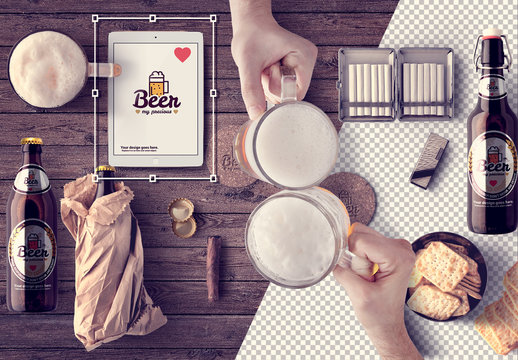 2 Toasting Mugs at a Table with Beer Bottles and Devices Mockup