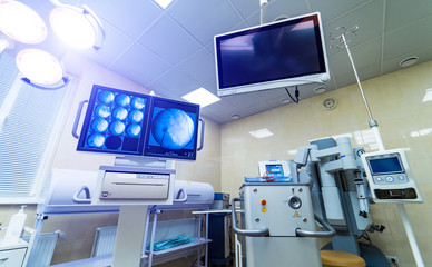 Medical devices, Interior hospital design concept. Interior of operating room in modern clinic, screen with tests closeup
