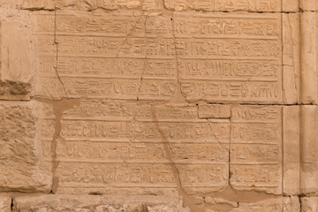 Karnak Temple, complex of Amun-Re. Embossed hieroglyphics on walls. Luxor Governorate, Egypt.