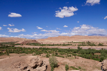Casbah with green gorge, surrounded by desert, Morocco, Africa