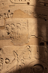 Karnak Temple, complex of Amun-Re. Embossed hieroglyphics on columns. Great Hypostyle Hall. Columns...