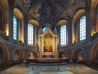 Fototapeta na wymiar Apse and altar of Turku Cathedral, Finland. The altarpiece was painted in 1836 by Swedish artist Fredrik Westin. The wall frescoes were created by court painter Robert Wilhelm Ekman in 1850-1854.