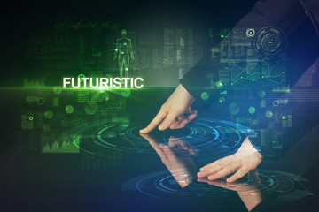 Businessman touching huge display with FUTURISTIC inscription, modern technology concept