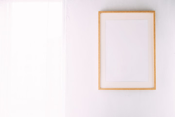 Frame on a white wall with place for text.