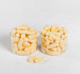 Dry quick healthy Breakfast, sweet corn sticks on a light background