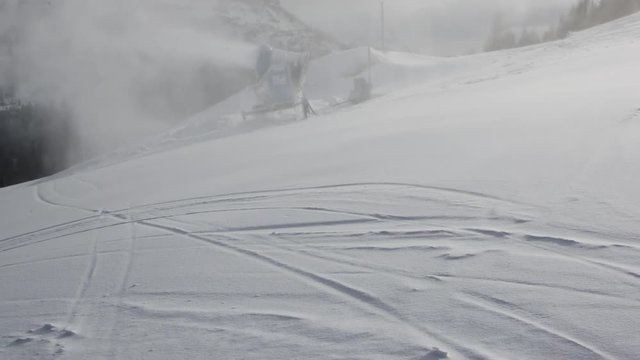 A scene during working time of snow cannon which makes an artificial snow at ski resort Nassfeld, Austria.
