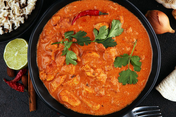 Chicken tikka masala spicy curry meat food in pot with rice and naan bread. indian food