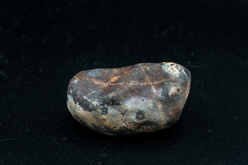 Naklejka premium Chondrite Meteorite L6W2 Type isolated, piece of rock formed as an asteroid in the universe at during Solar System creation. The meteorite comes from an asteroid fall impacting Earth at Atacama Desert